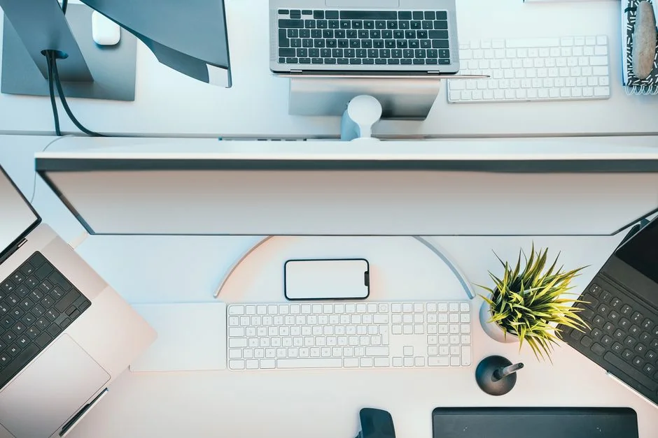 Businesswoman analyzing design portfolio in modern office setting.